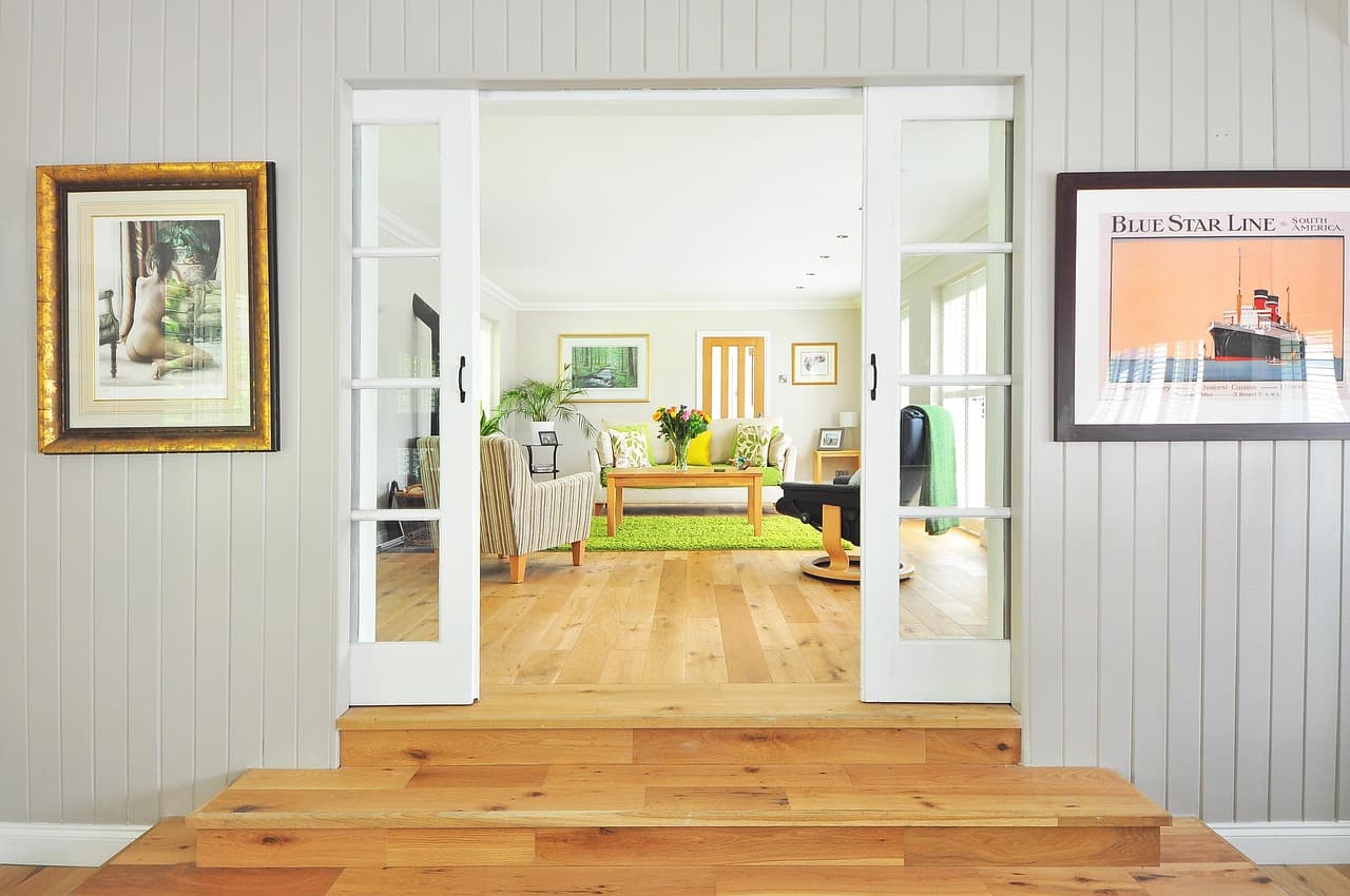 Couple smiling in their beautiful remodeled living room